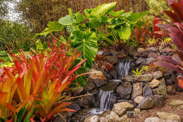 an aerial view of a house with a yard and outdoor seating