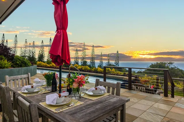 a view of swimming pool with a chairs