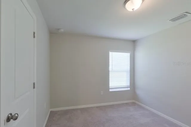 an empty room with a window