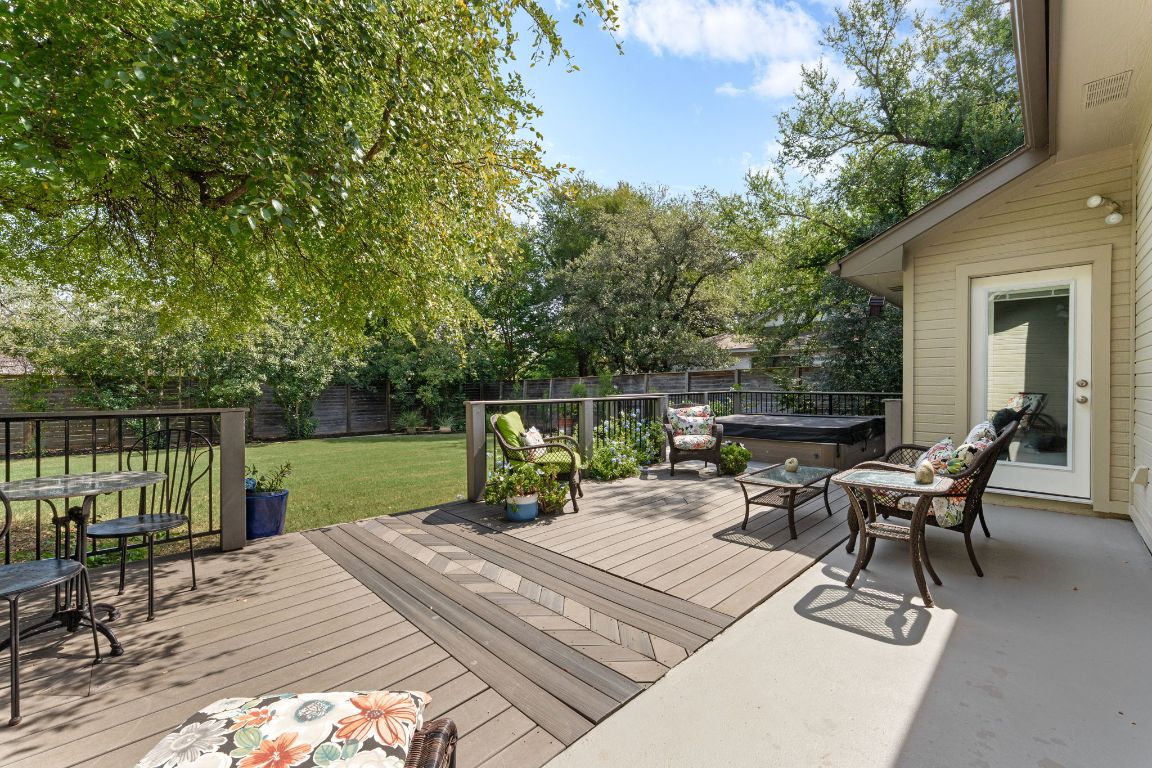 15202 Sun-Bird Lane Austin, TX 78734 - Photo 11 of 28 a view of a patio with a dining table and chairs with wooden floor