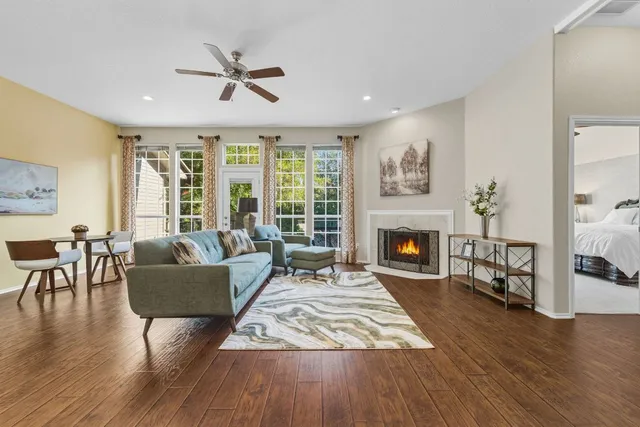 a living room with furniture and a fireplace