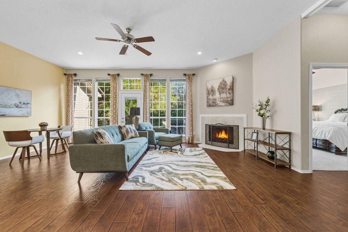 15202 Sun-Bird Lane Austin, TX 78734 - Photo 12 of 28 a living room with furniture and a fireplace