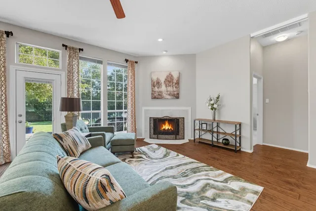 a living room with furniture and a fireplace