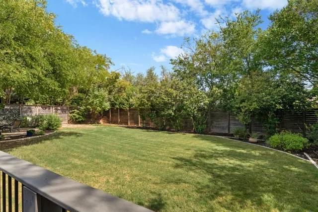 a backyard of a house with lots of green space