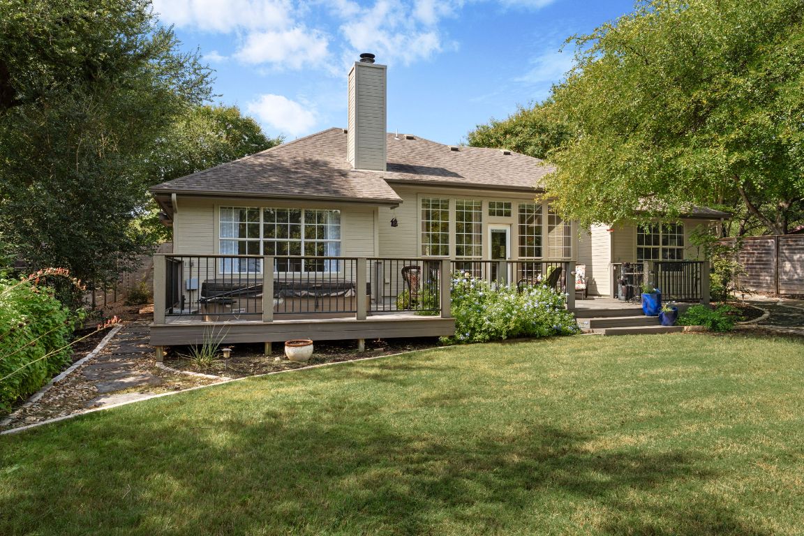 15202 Sun-Bird Lane Austin, TX 78734 - Photo 22 of 28 a front view of a house with a garden and plants