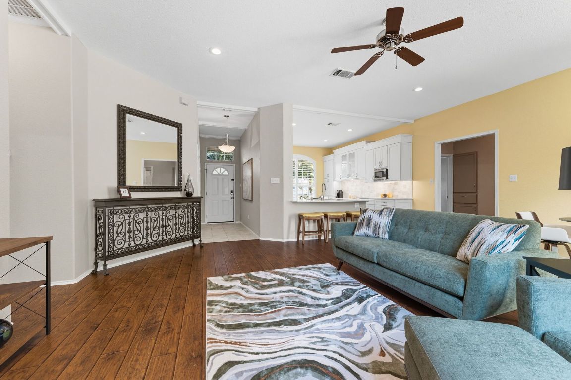 15202 Sun-Bird Lane Austin, TX 78734 - Photo 3 of 28 a living room with furniture and a wooden floor