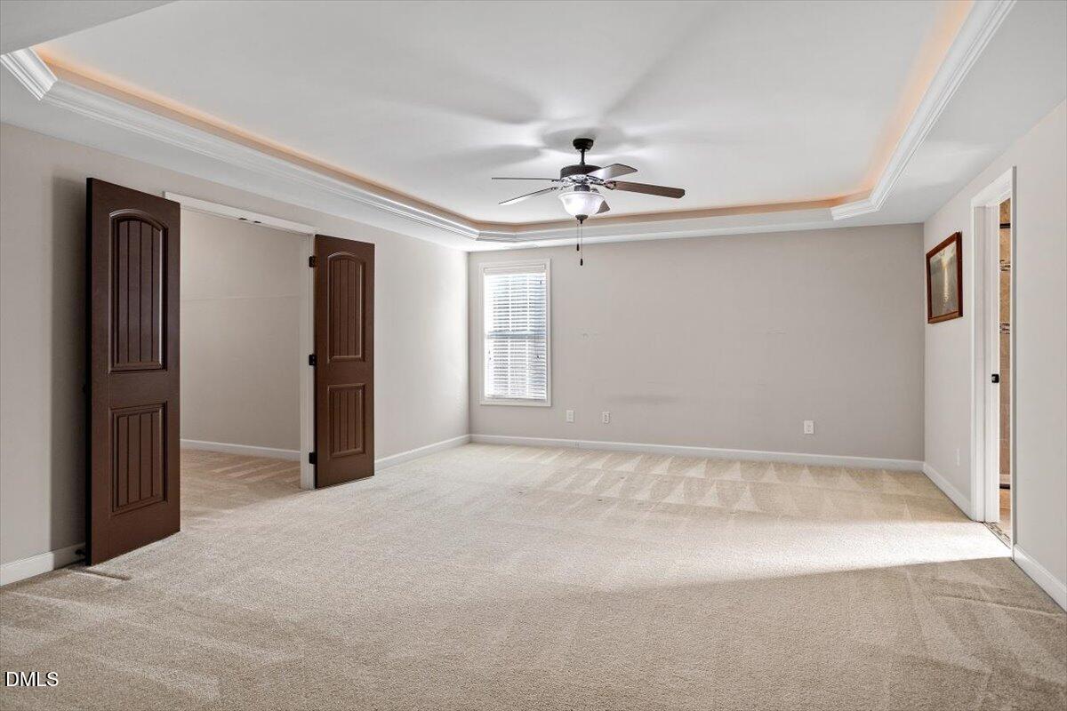 109 North Sunset Ridge Drive Willow Spring, NC 27592 - Photo 19 of 54 a view of empty room with a ceiling fan