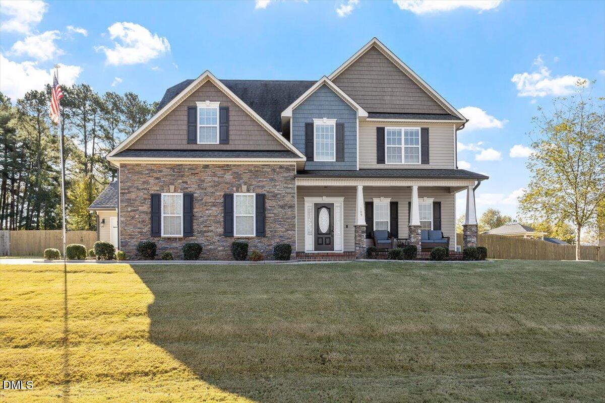 109 North Sunset Ridge Drive Willow Spring, NC 27592 - Photo 2 of 54 a front view of a house with a yard