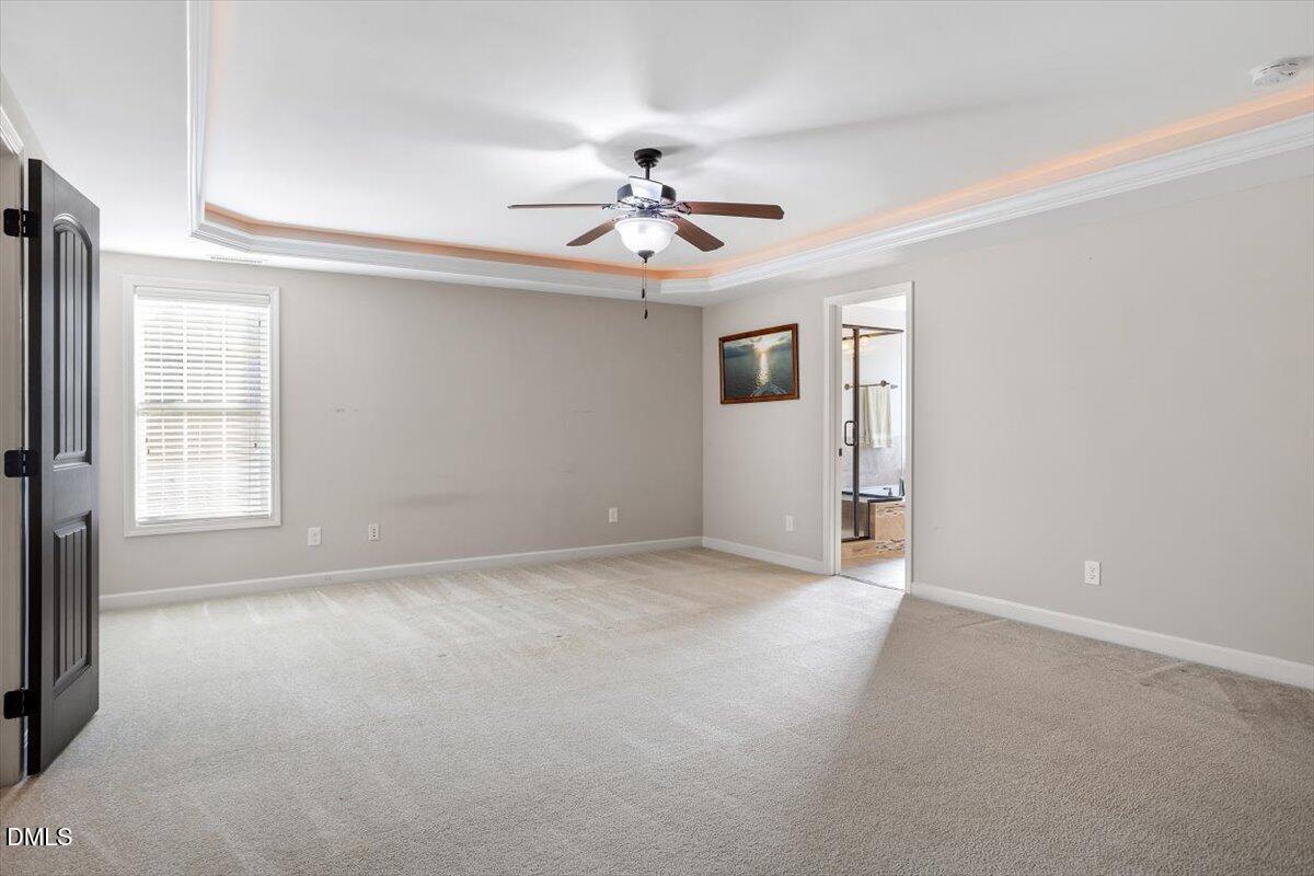 109 North Sunset Ridge Drive Willow Spring, NC 27592 - Photo 21 of 54 a view of an empty room with a window