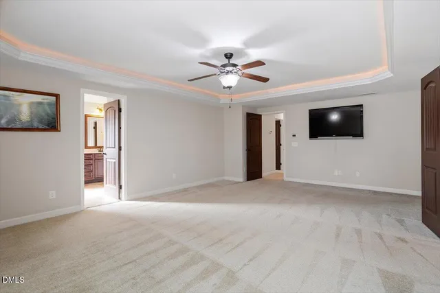 a bathroom with a tub a double vanity sink and a large mirror