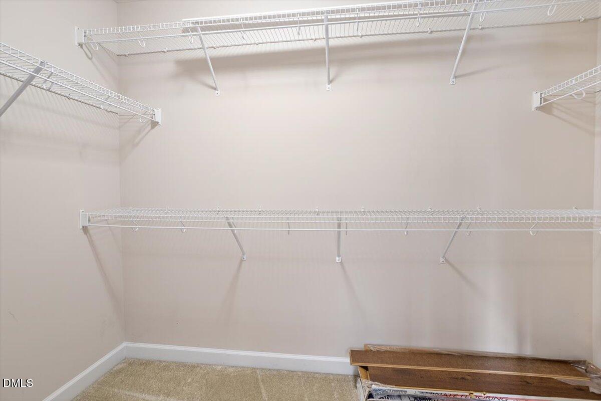 109 North Sunset Ridge Drive Willow Spring, NC 27592 - Photo 26 of 54 a view of a room with racks on the wall