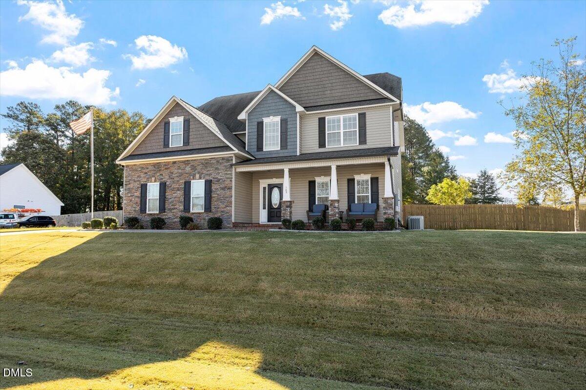109 North Sunset Ridge Drive Willow Spring, NC 27592 - Photo 3 of 54 a front view of a house with a yard