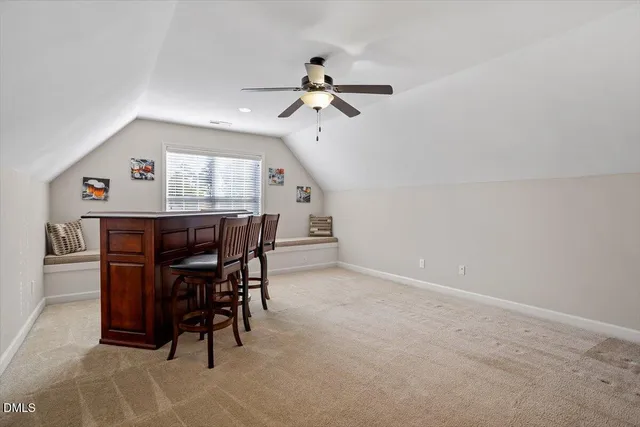 a bathroom with a toilet a sink a tub and a mirror
