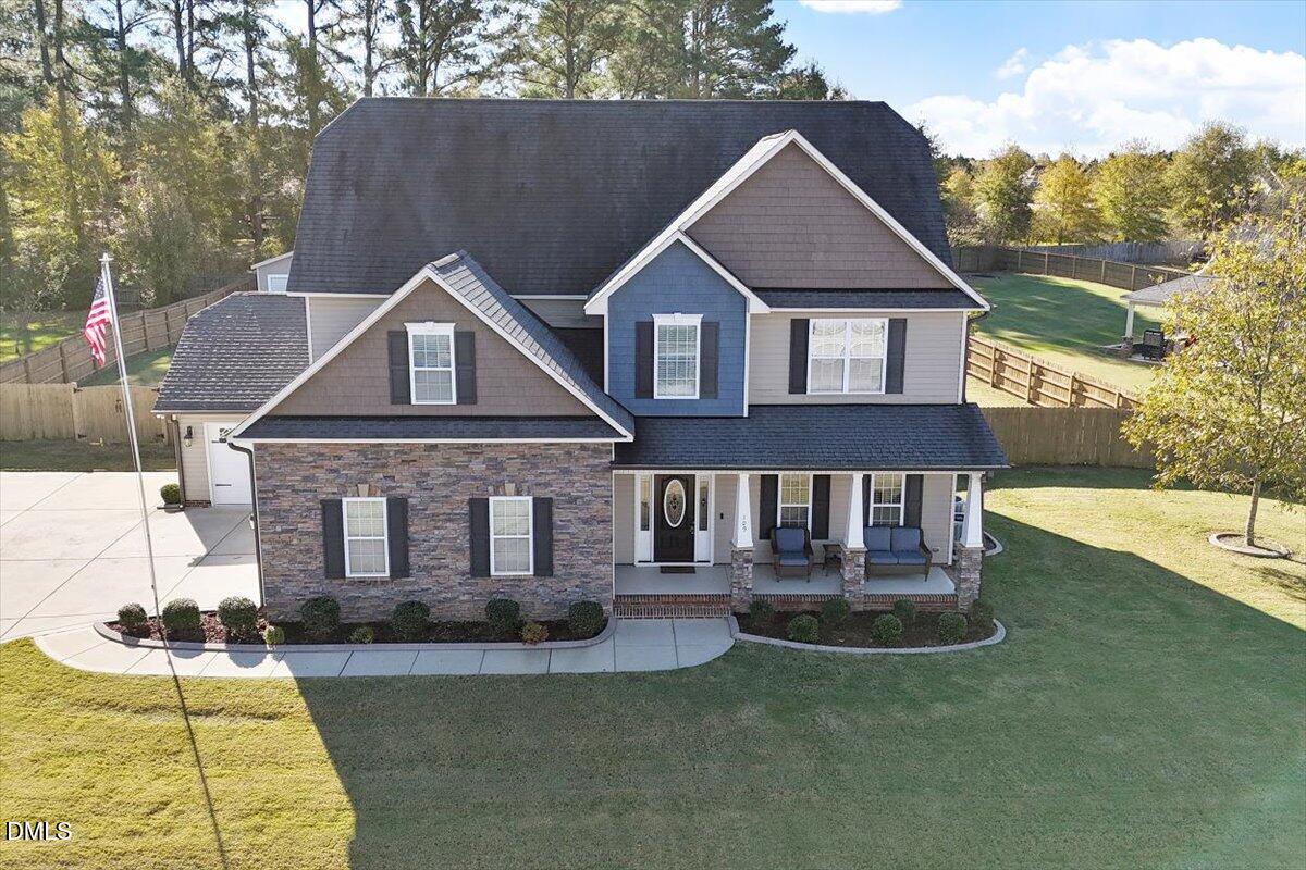 109 North Sunset Ridge Drive Willow Spring, NC 27592 - Photo 37 of 54 a front view of a house with a yard