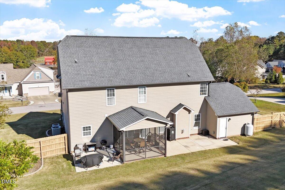 109 North Sunset Ridge Drive Willow Spring, NC 27592 - Photo 41 of 54 a aerial view of a house with table and chairs