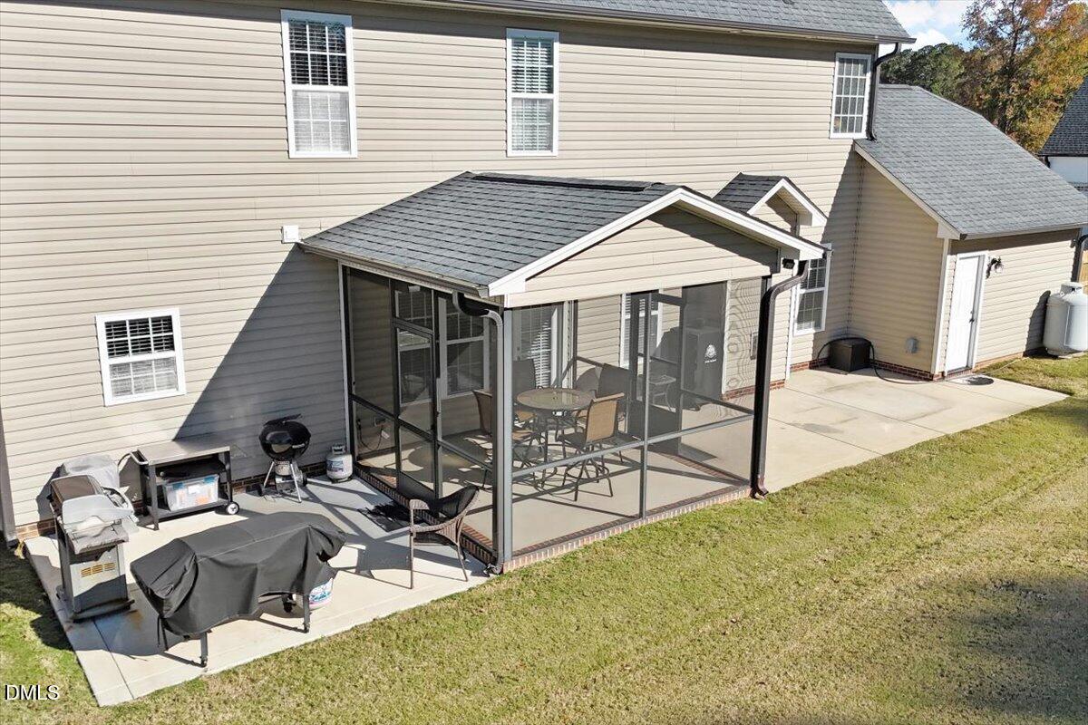 109 North Sunset Ridge Drive Willow Spring, NC 27592 - Photo 43 of 54 a view of a house with backyard and sitting area