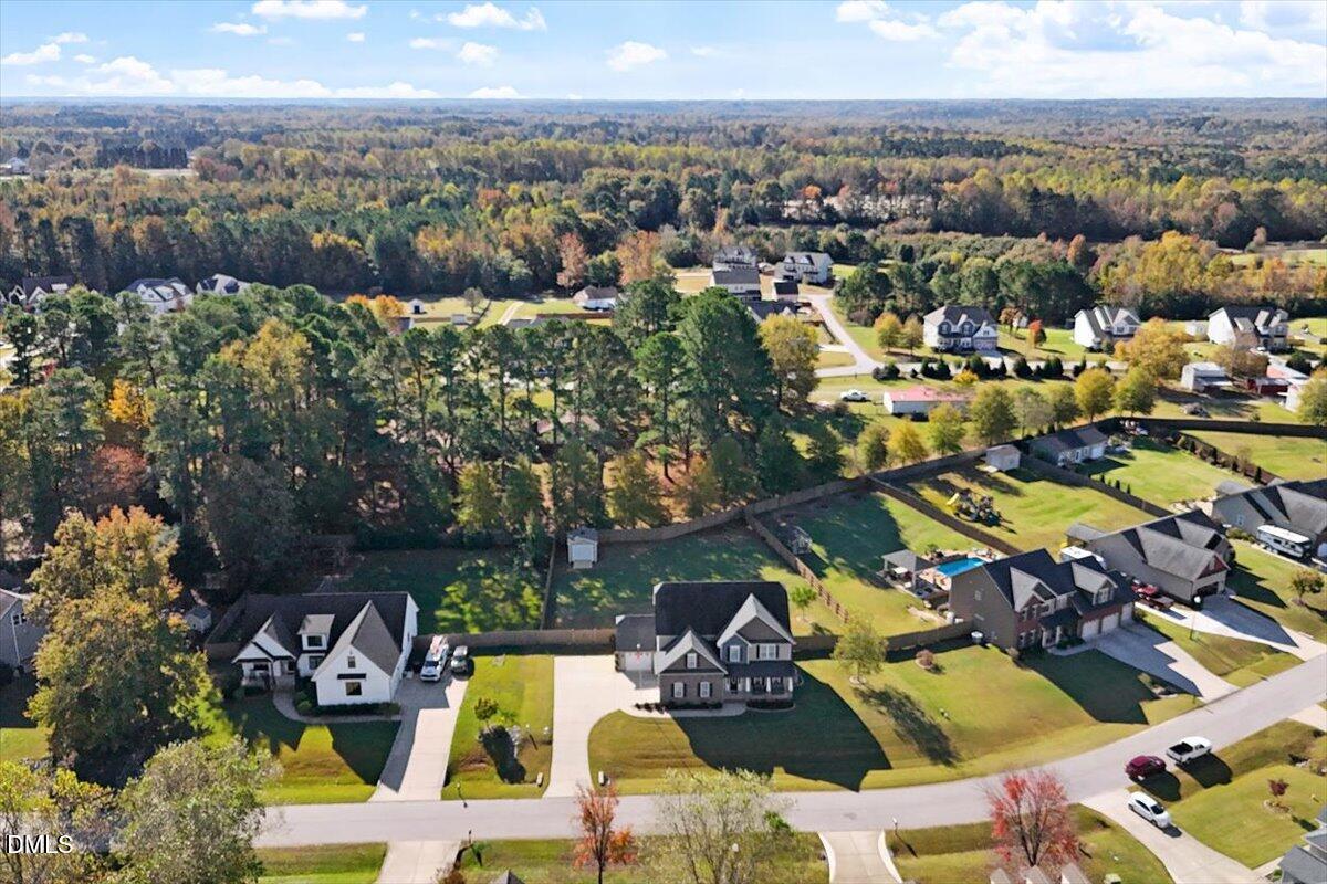 109 North Sunset Ridge Drive Willow Spring, NC 27592 - Photo 54 of 54 an aerial view of a houses with a lake