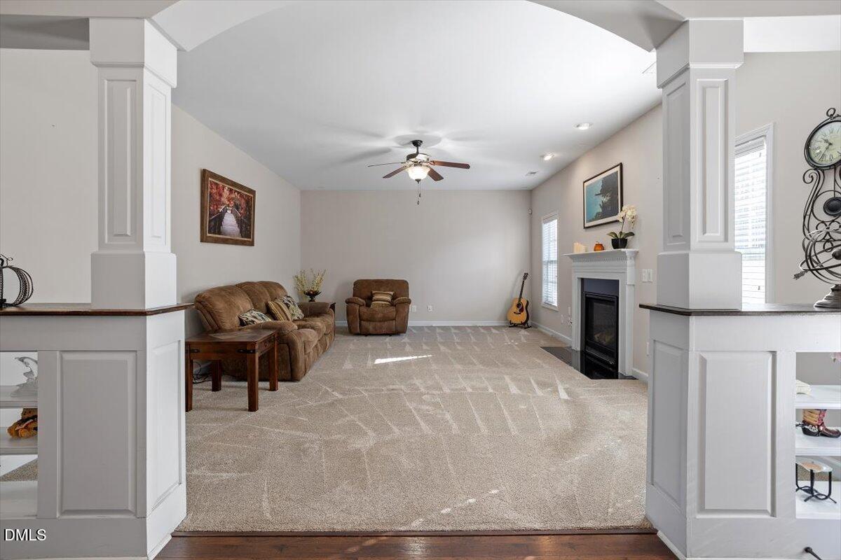 109 North Sunset Ridge Drive Willow Spring, NC 27592 - Photo 6 of 54 a living room with furniture and a fireplace