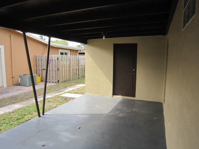 117 Engle Road Lake Worth, FL 33461 - Photo 2 of 15 Carport/Laundry Utility