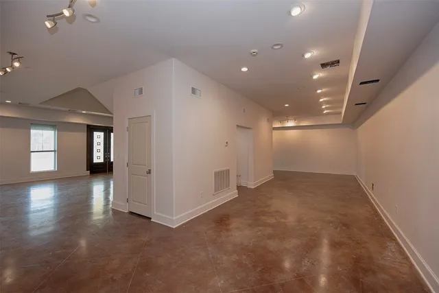a kitchen with granite countertop a sink and cabinets