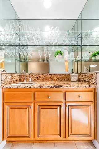 a bedroom with furniture and a large window