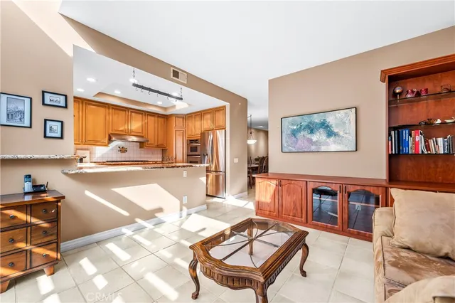 a living room with furniture a rug and a wooden floor