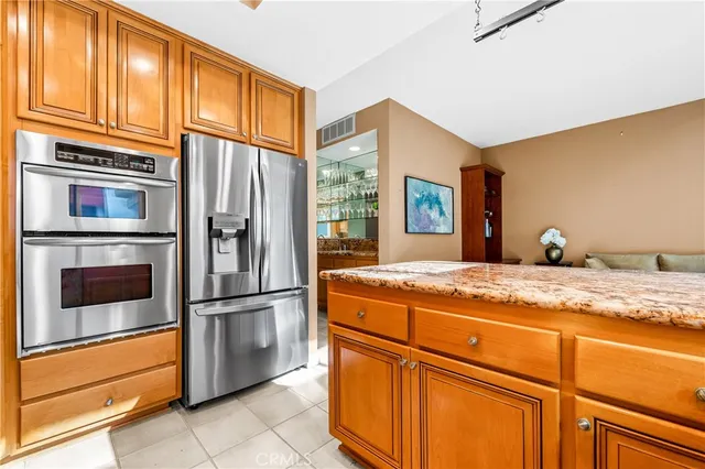 a very nice looking kitchen with a large window