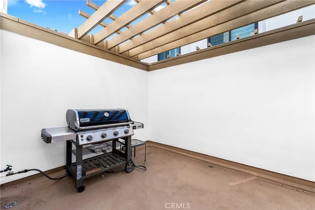 a view of a chairs and table in the patio