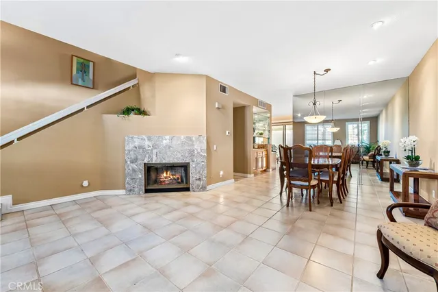 a view of a dining room with furniture and a window