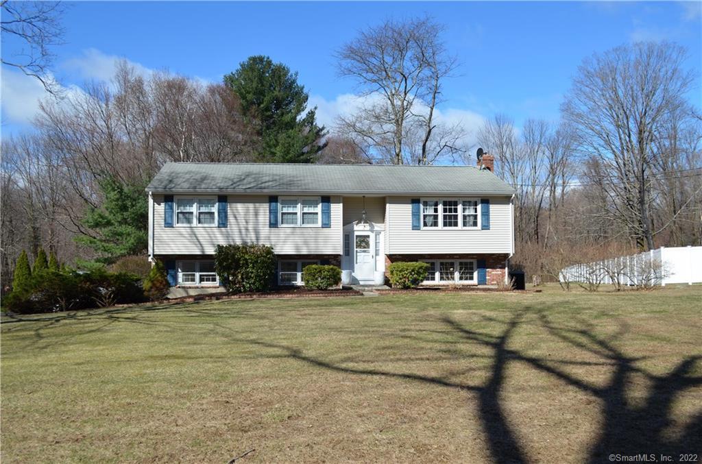 96 Case Street Canton, CT 06019 - Photo 1 of 1 a view of a white house with a big yard and large trees