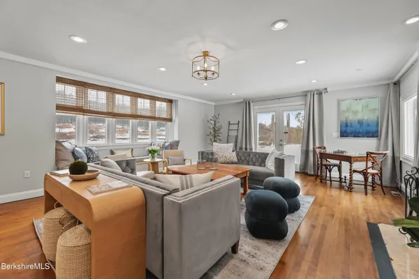 a kitchen with stainless steel appliances granite countertop a refrigerator stove and sink