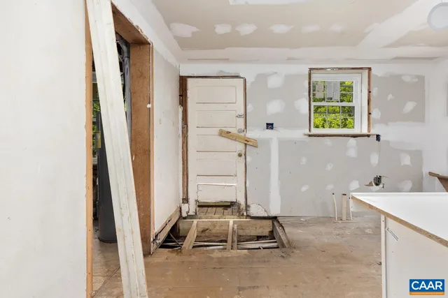 a view of empty room with windows