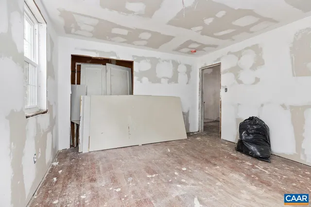 a view of a garden with a house