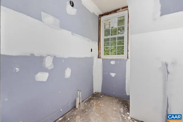 a view of a mountain range with lush green forest