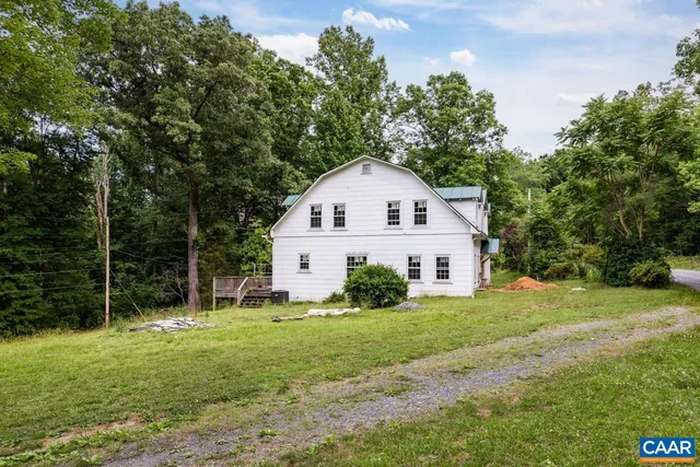 a bedroom with furniture and windows