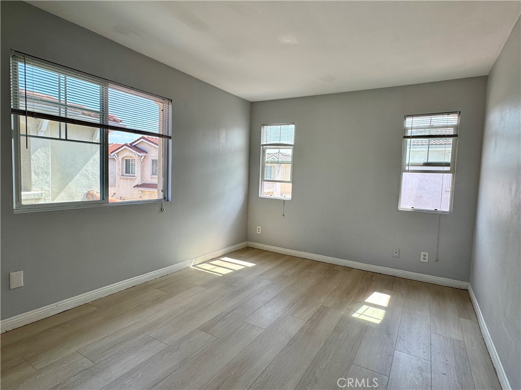 2840 Maxson Road El Monte, CA 91732 - Photo 11 of 20 an empty room with wooden floor and windows