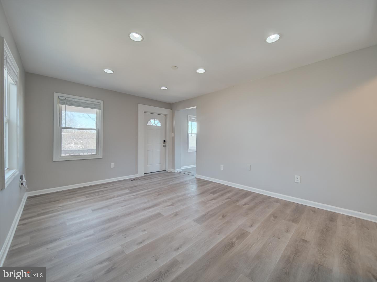 4217 Vine Street Capitol Heights, MD 20743 - Photo 11 of 60 an empty room with wooden floor and windows