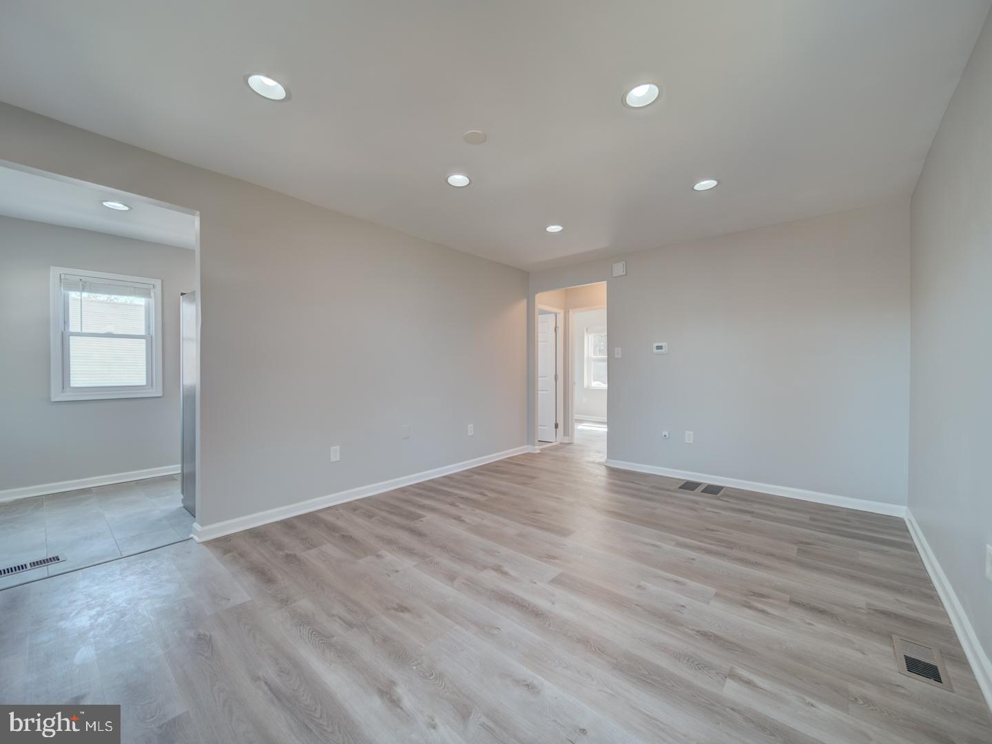 4217 Vine Street Capitol Heights, MD 20743 - Photo 12 of 60 a view of an empty room with wooden floor and a window