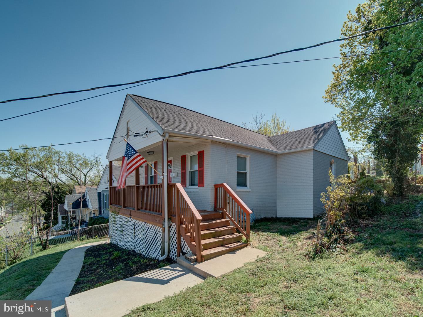 4217 Vine Street Capitol Heights, MD 20743 - Photo 2 of 60 a front view of a house with garden