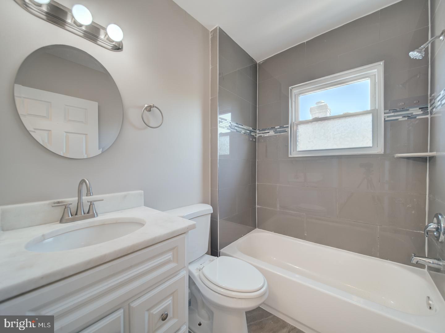 4217 Vine Street Capitol Heights, MD 20743 - Photo 25 of 60 a bathroom with a sink a toilet and a bathtub