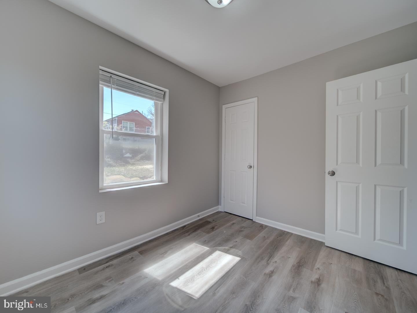 4217 Vine Street Capitol Heights, MD 20743 - Photo 29 of 60 an empty room with wooden floor and windows