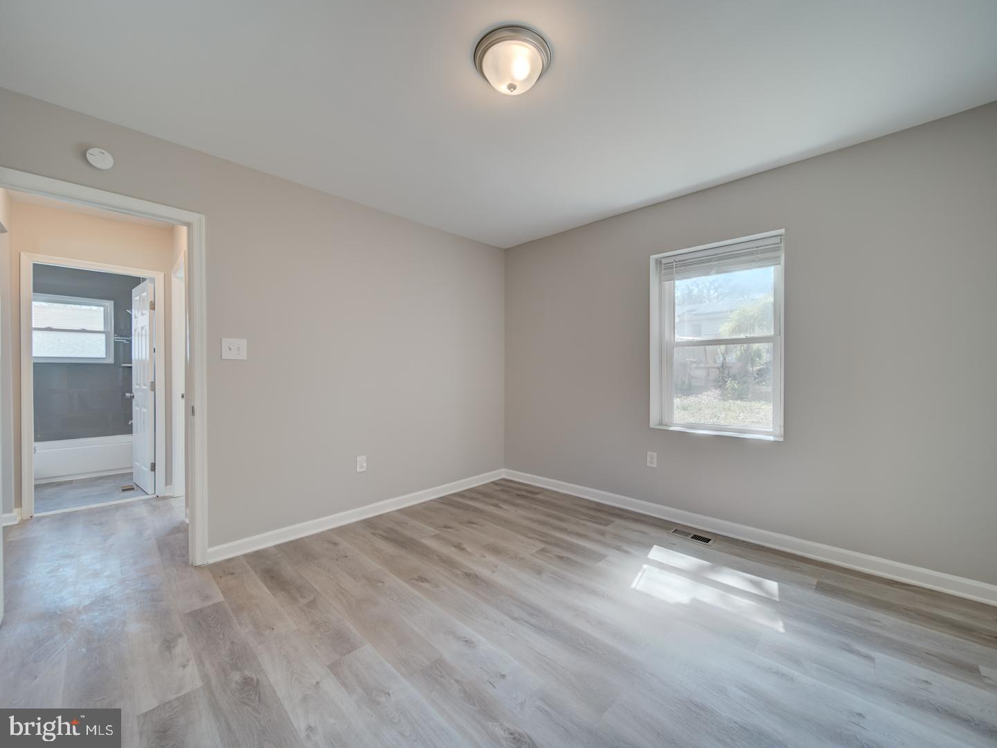 4217 Vine Street Capitol Heights, MD 20743 - Photo 36 of 60 an empty room with wooden floor and windows