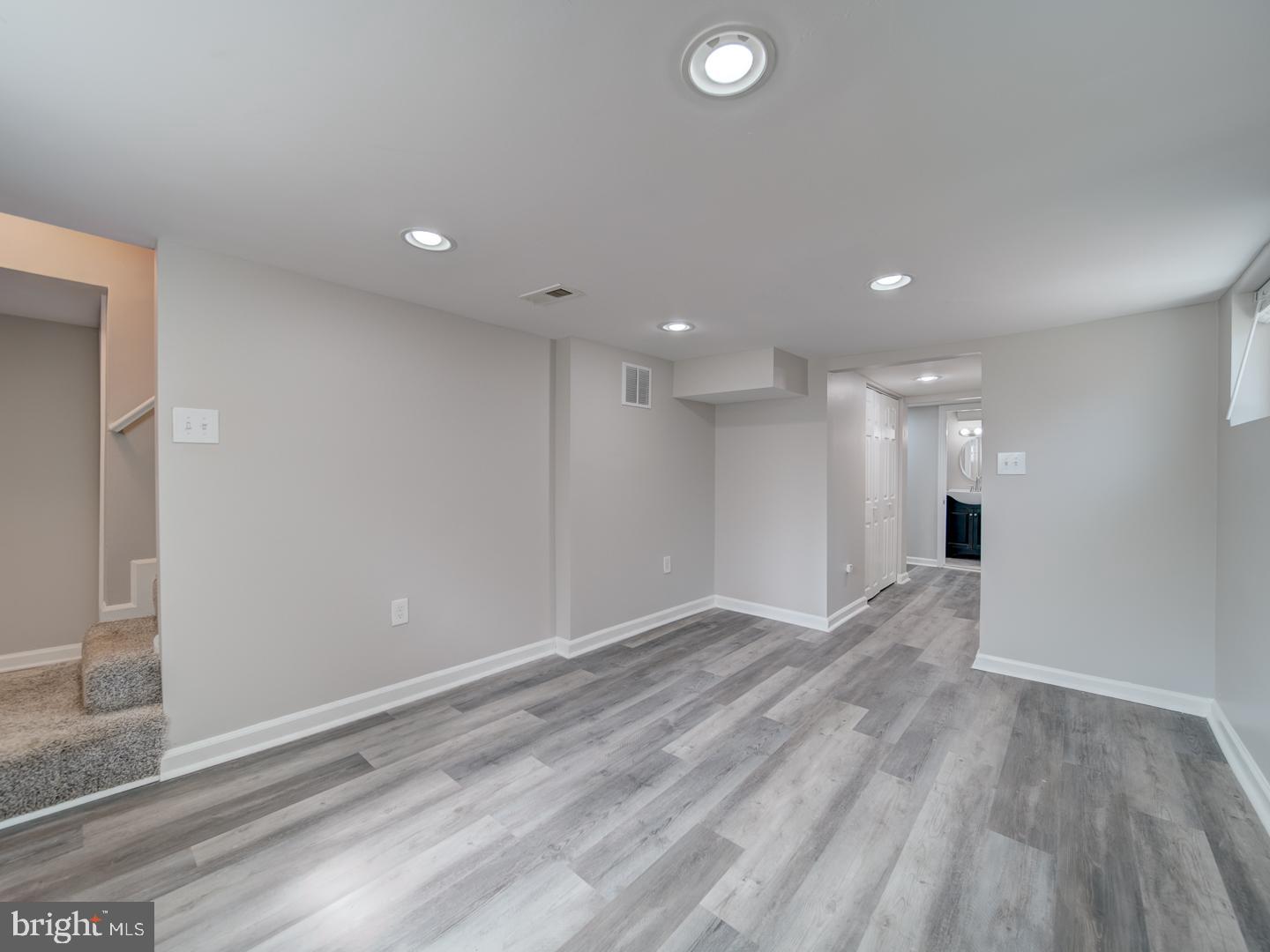 4217 Vine Street Capitol Heights, MD 20743 - Photo 37 of 60 a view of empty room with wooden floor