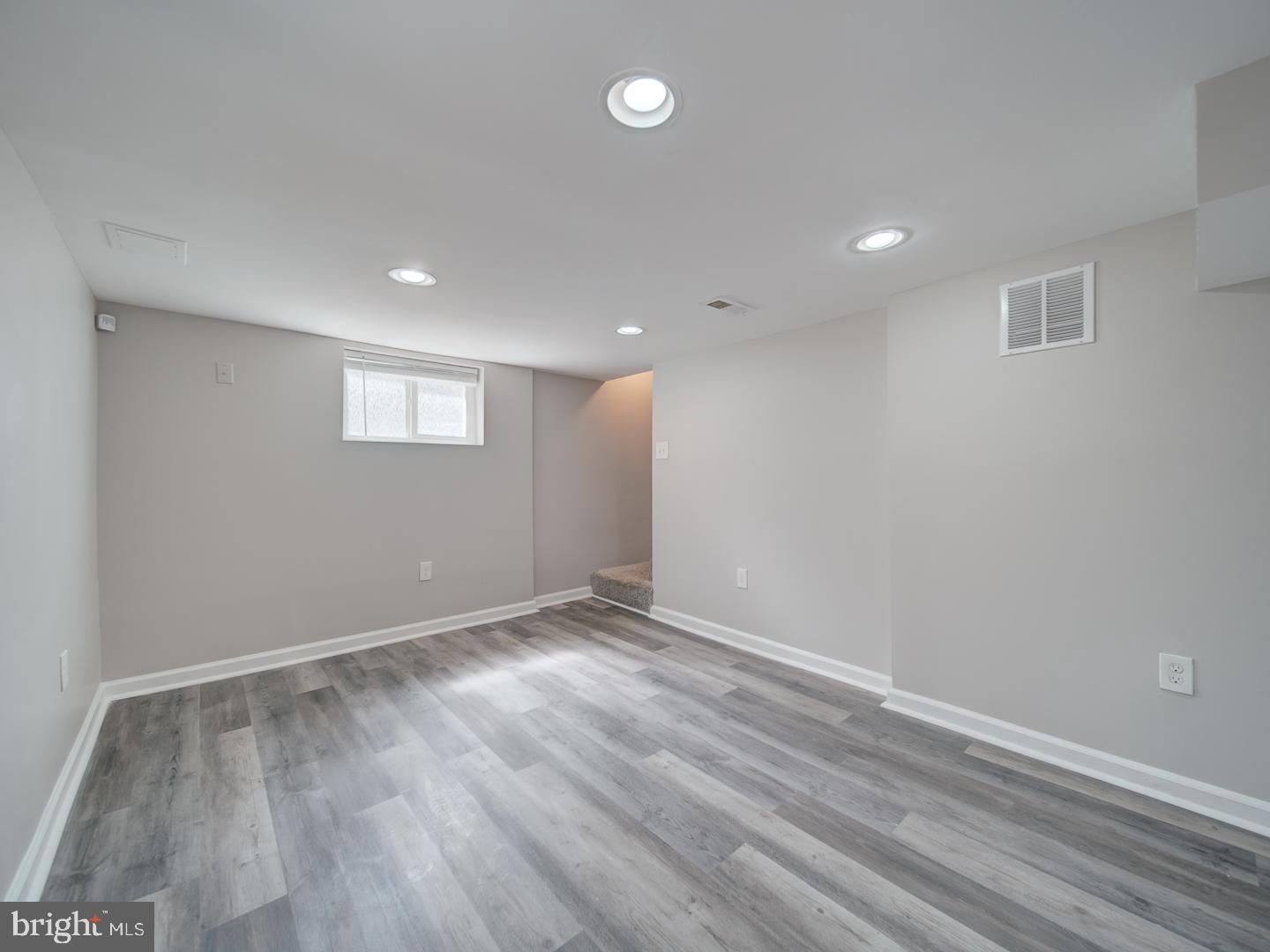4217 Vine Street Capitol Heights, MD 20743 - Photo 40 of 60 an empty room with wooden floor and windows