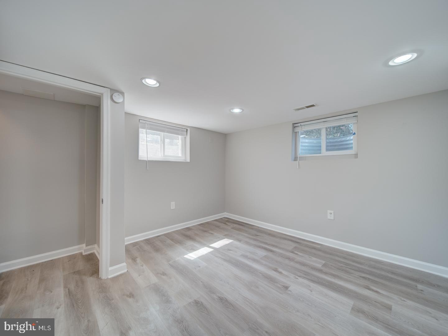 4217 Vine Street Capitol Heights, MD 20743 - Photo 48 of 60 an empty room with wooden floor and windows