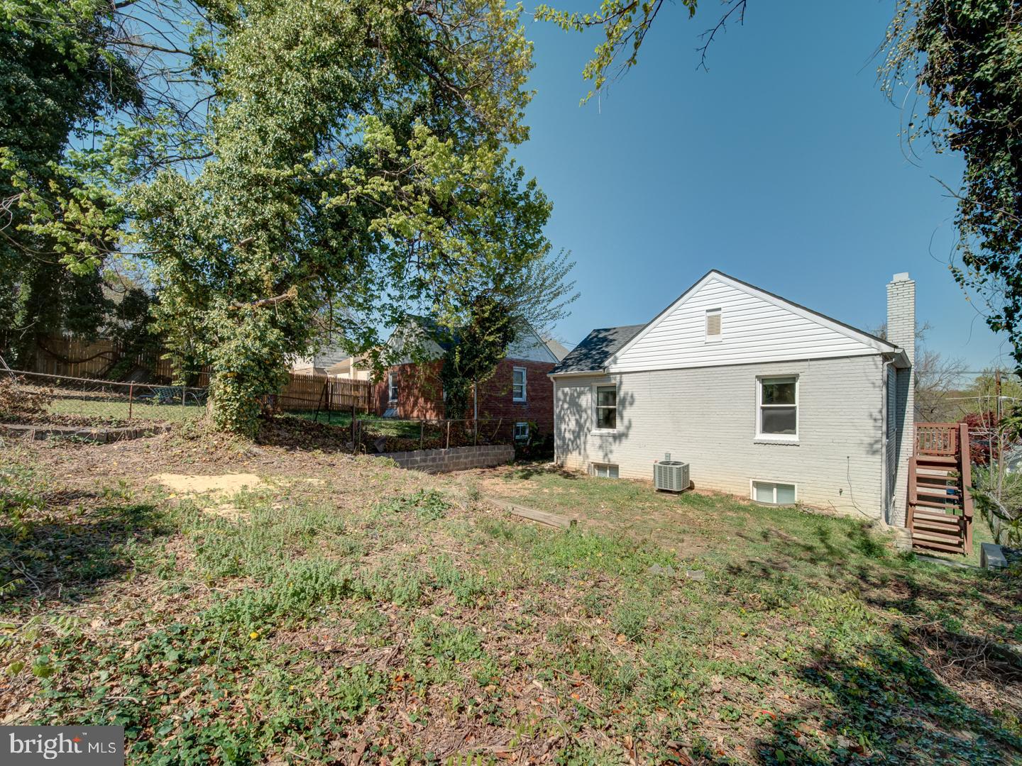 4217 Vine Street Capitol Heights, MD 20743 - Photo 56 of 60 a backyard of a house with a large tree