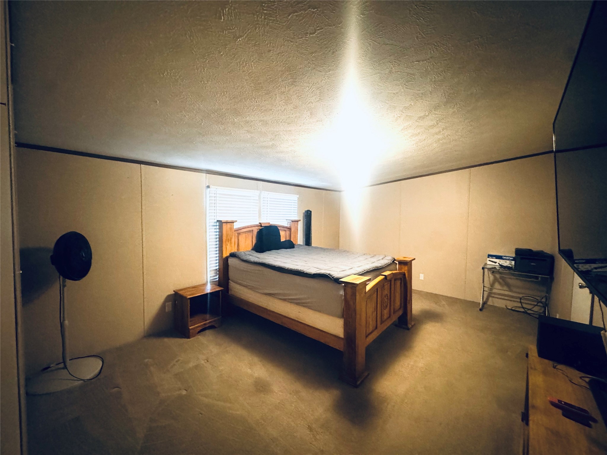 235 Red Oak Onalaska, TX 77360 - Photo 7 of 12 a bedroom with a bed and a table in it