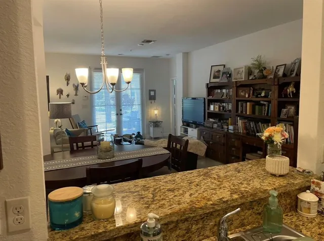 a large room with lots of clutter and furniture