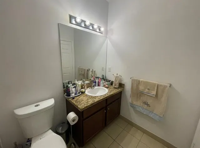 a bathroom with a shower and toilet