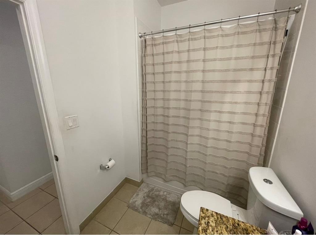817 Southwest 147th Avenue, Unit 817 Pembroke Pines, FL 33027 - Photo 19 of 34 a bathroom with a shower and toilet